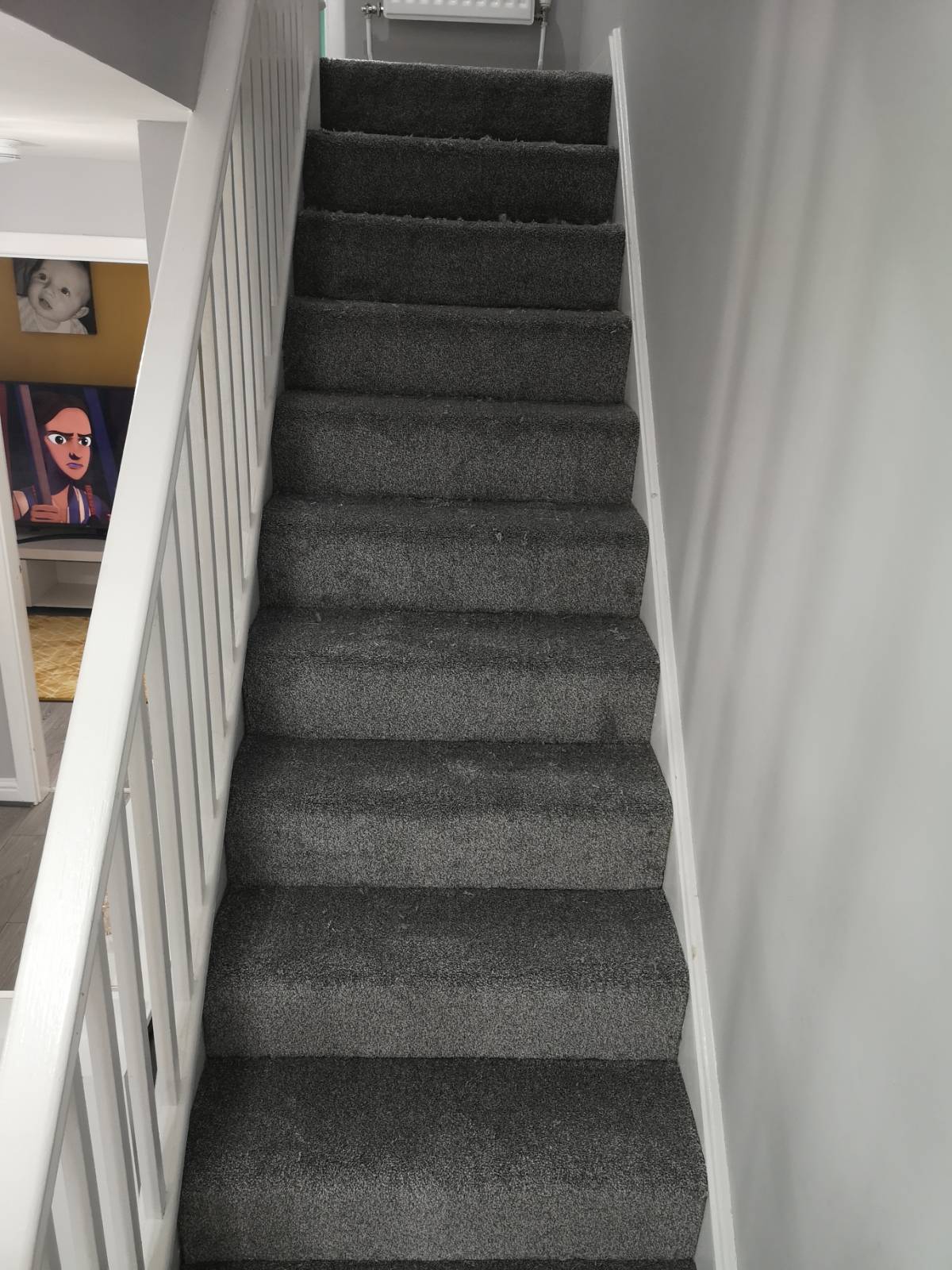 after image of grey carpet fitted on staircase