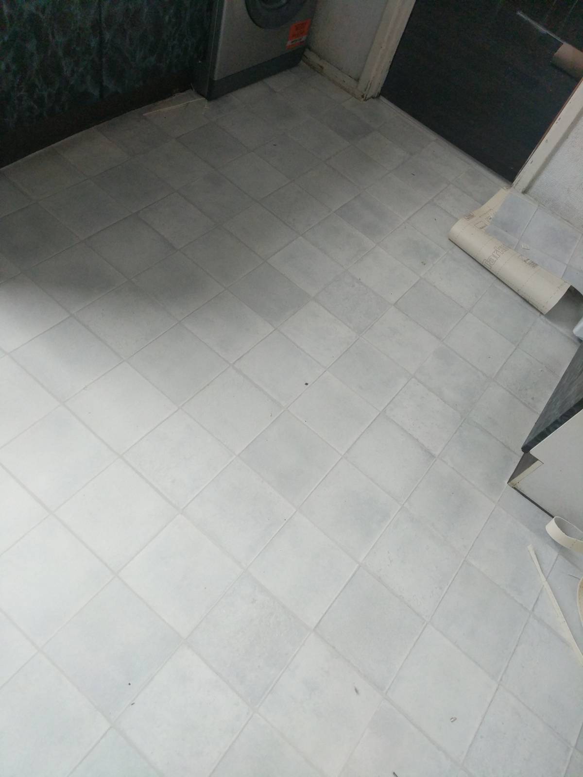 light vinyl flooring with tile design in kitchen