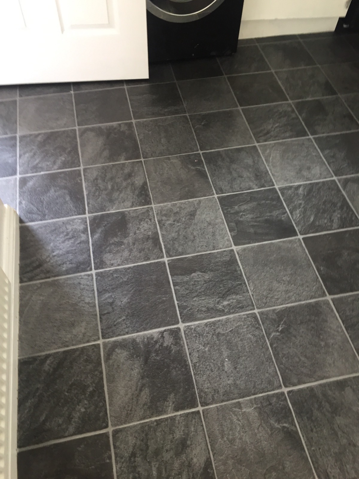 dark tile design vinyl flooring in kitchen 