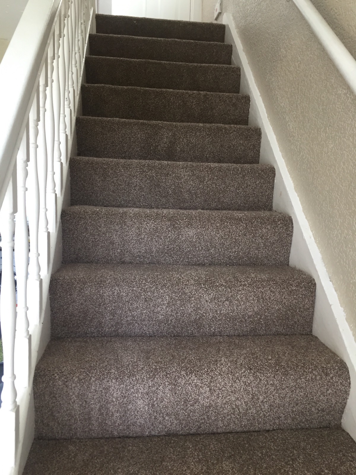 light grey carpet fitted on white stairecase
