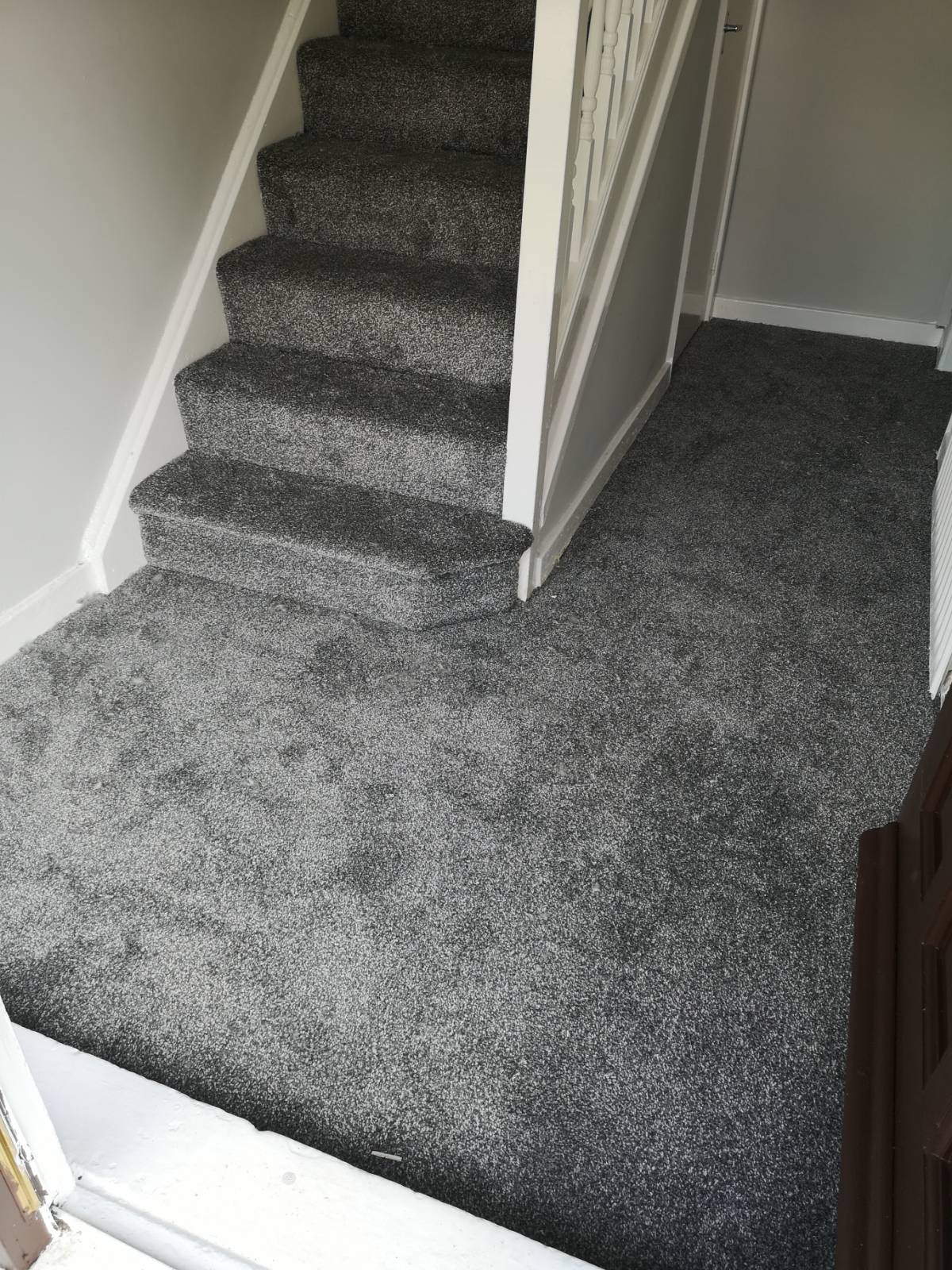 grey carpet fitting on staircase and hallway 