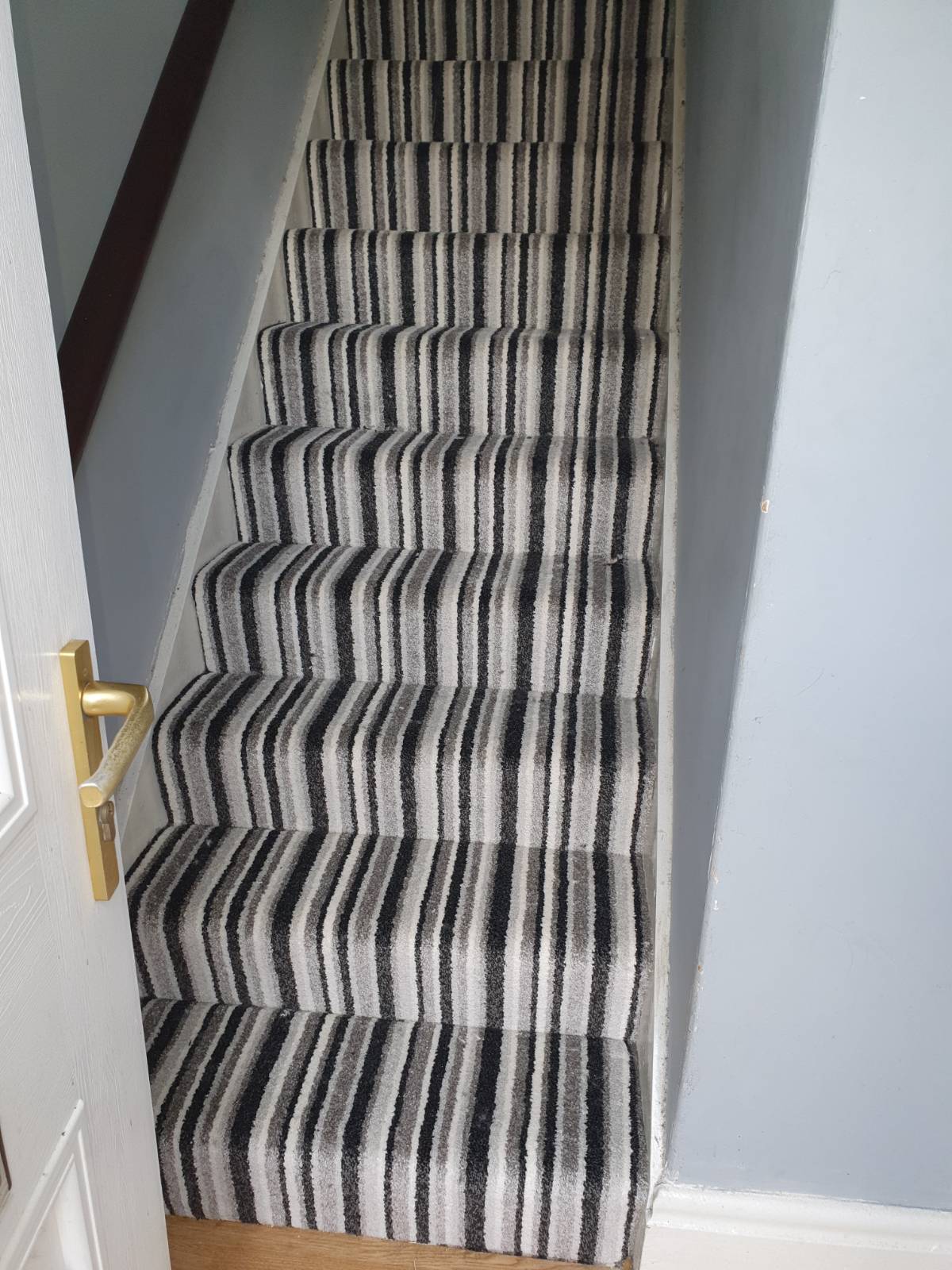 grand stripe carpet fitted on stair case